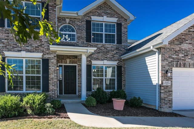 doorway to property featuring a garage