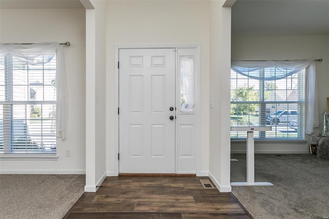 view of carpeted entrance foyer