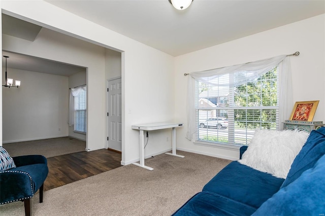 sitting room with dark wood-type flooring