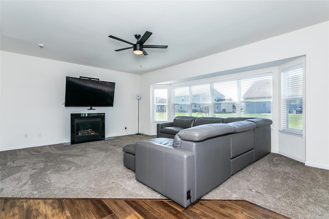 living room with ceiling fan, plenty of natural light, and hardwood / wood-style floors