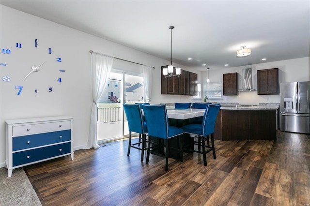 dining area with dark hardwood / wood-style flooring