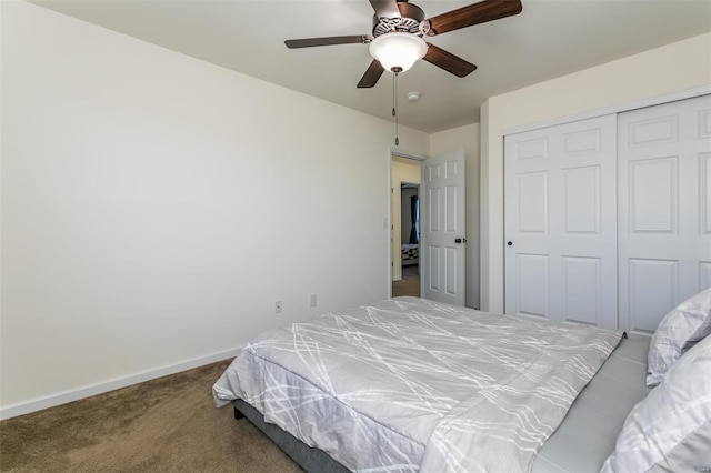 bedroom with carpet floors, a closet, and ceiling fan