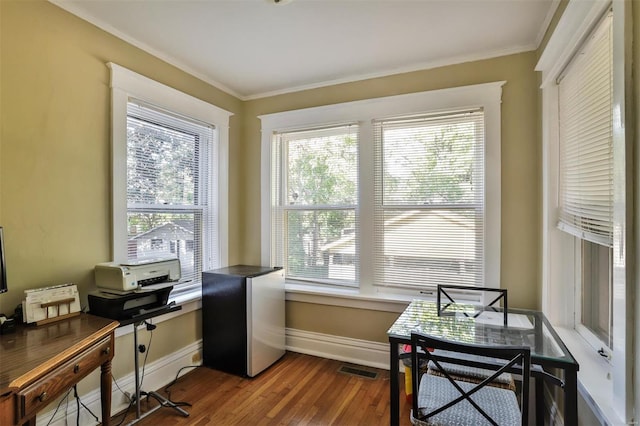 office area with ornamental molding, hardwood / wood-style flooring, and a wealth of natural light