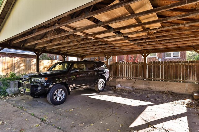 view of vehicle parking with a carport