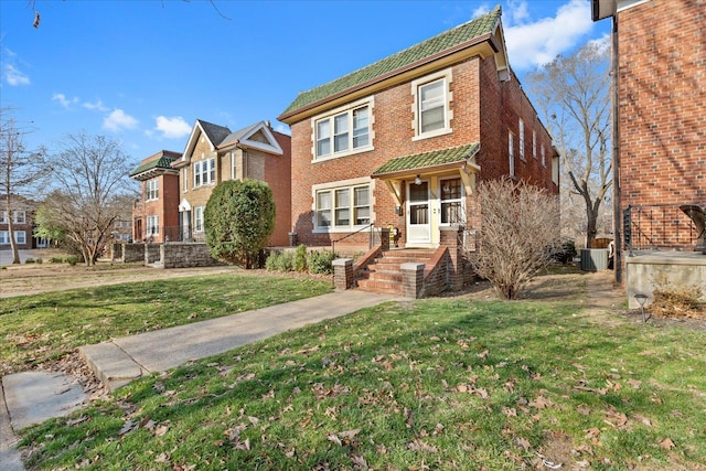 view of front of property with central air condition unit, brick siding, and a front lawn