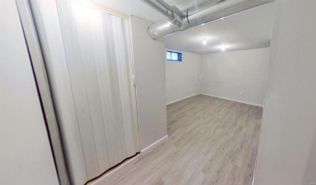 basement featuring light wood-type flooring