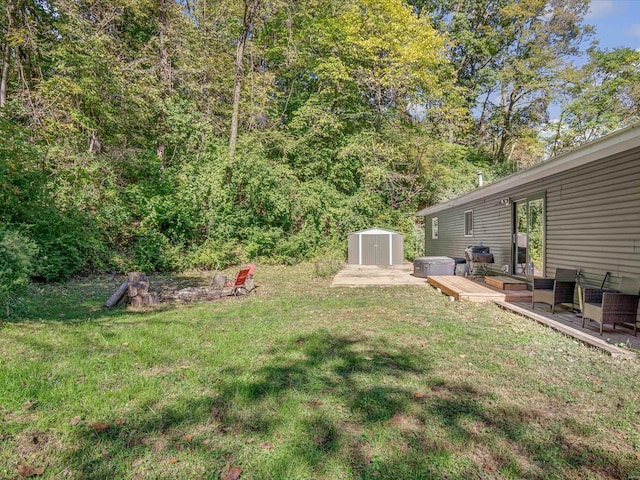 view of yard featuring a deck and a shed