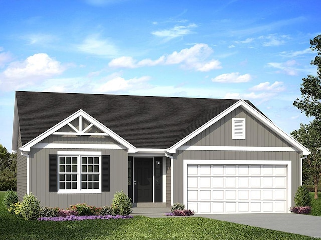 view of front of property featuring a garage and a front lawn