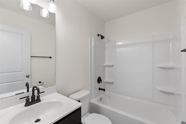 full bathroom with bathtub / shower combination, vanity, and toilet