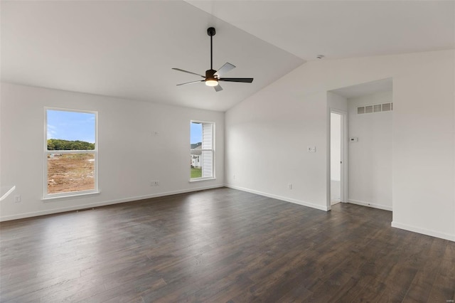 spare room with lofted ceiling, ceiling fan, and dark wood-type flooring