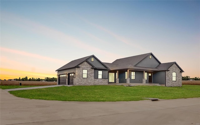 view of front of house with a lawn and a garage