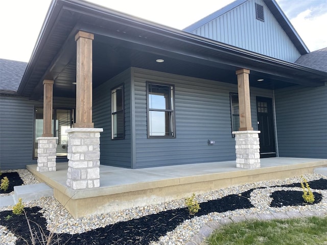 view of side of home featuring a porch