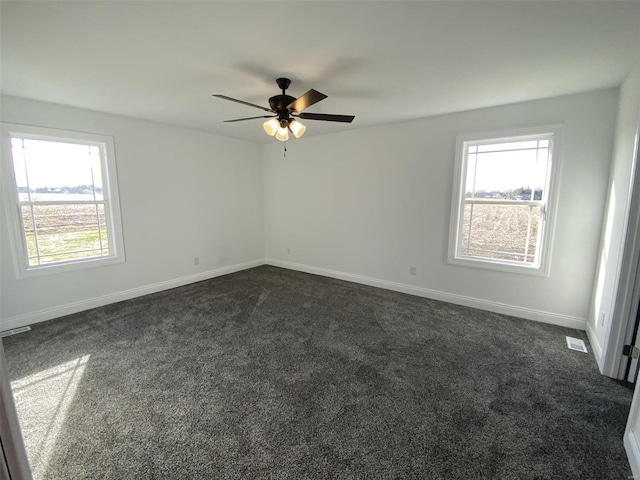 carpeted empty room featuring ceiling fan