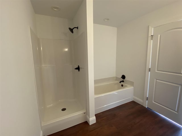 bathroom featuring separate shower and tub and hardwood / wood-style floors