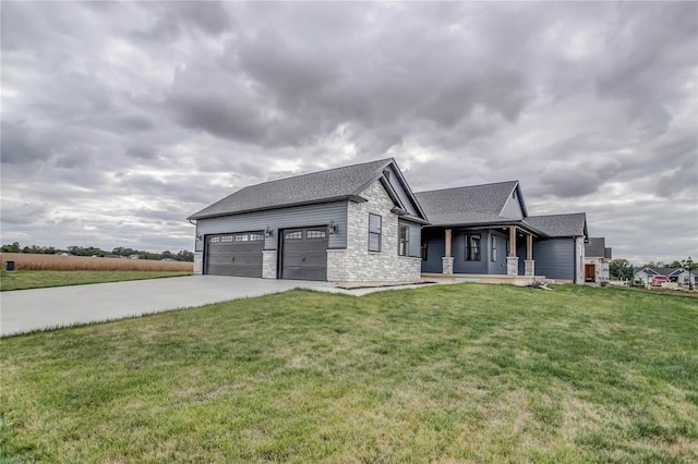 view of front of property featuring a garage and a front lawn