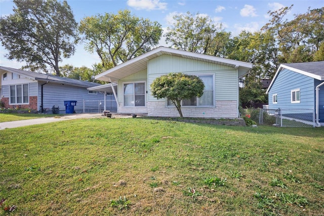 view of front of property featuring a front lawn and a patio area