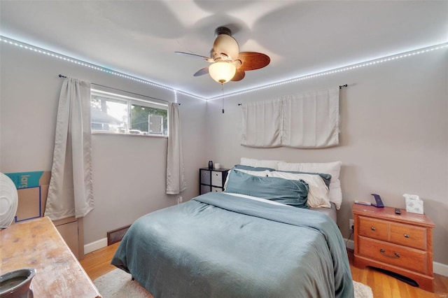 bedroom featuring light hardwood / wood-style flooring and ceiling fan