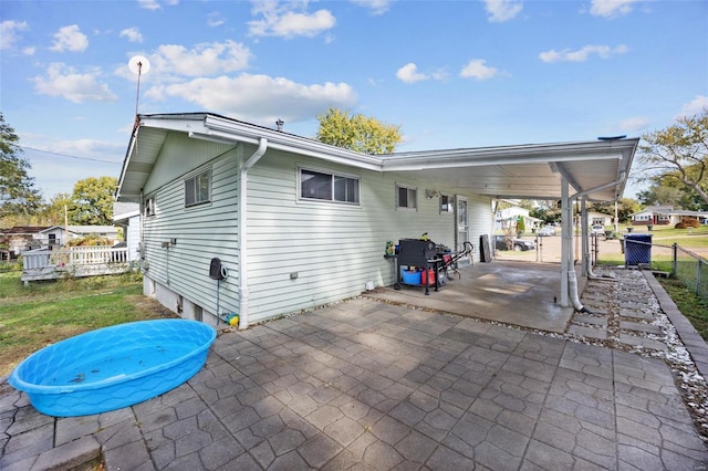 back of house with a patio area