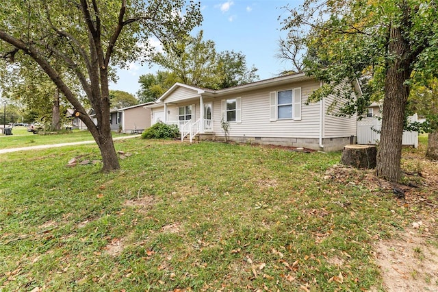 single story home with a front lawn