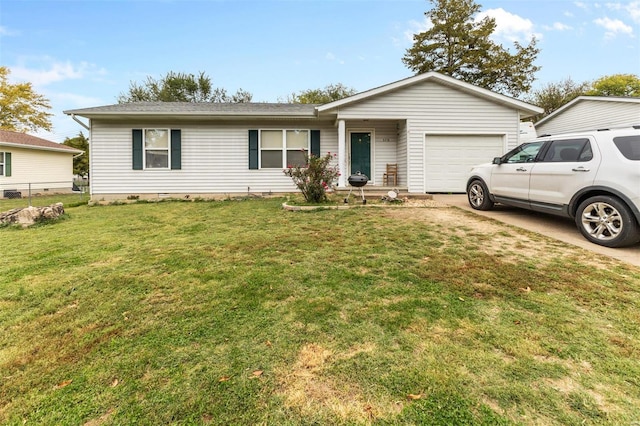 ranch-style house featuring a garage and a front lawn