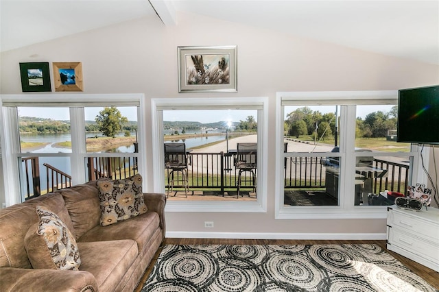 sunroom with vaulted ceiling with beams