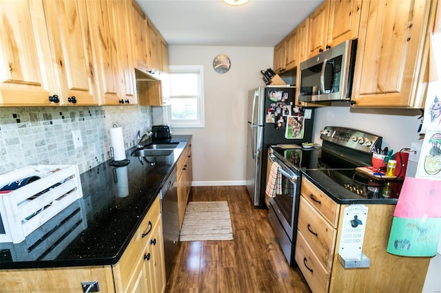 kitchen featuring decorative backsplash, stainless steel appliances, dark wood-type flooring, sink, and light brown cabinetry