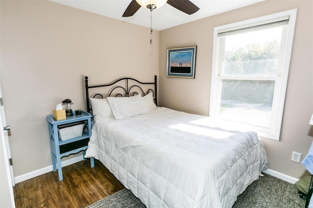 bedroom featuring dark wood-type flooring and ceiling fan