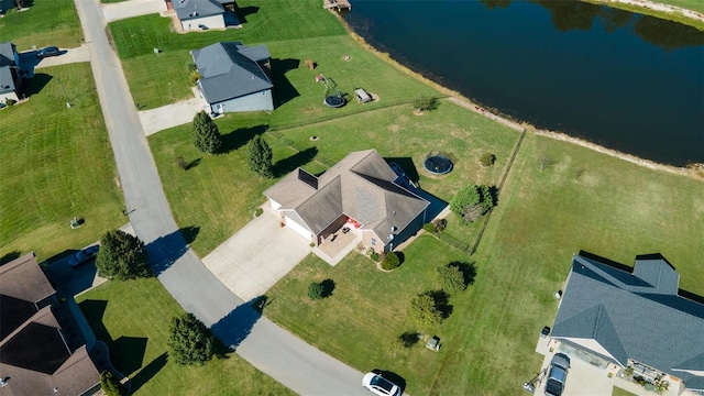 birds eye view of property featuring a water view and a residential view