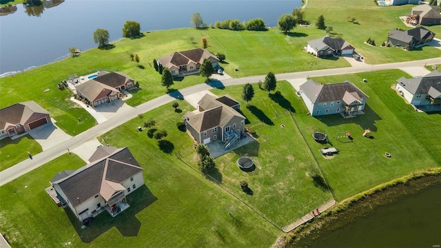 birds eye view of property with a residential view and a water view