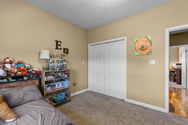 carpeted bedroom with a closet