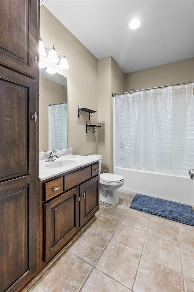 full bathroom featuring toilet, tile patterned flooring, vanity, and shower / bathtub combination with curtain