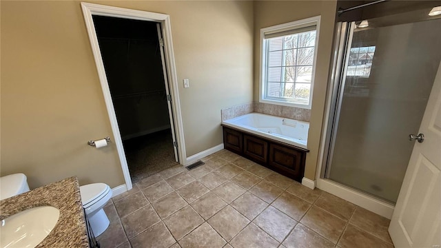 full bath featuring visible vents, toilet, a garden tub, a spacious closet, and a shower stall