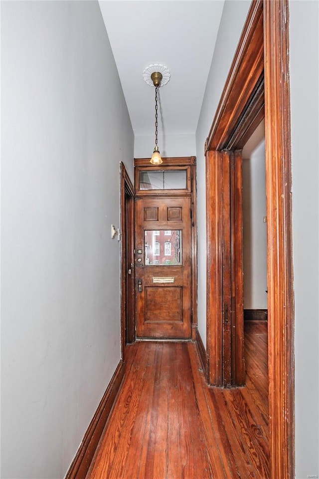 corridor featuring dark hardwood / wood-style floors