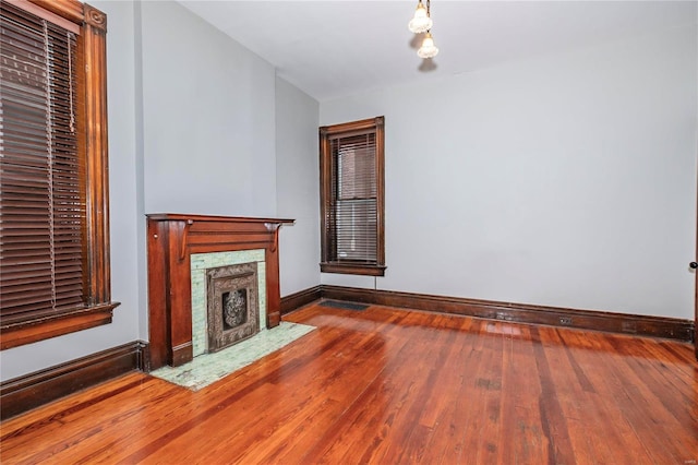 unfurnished living room featuring wood-type flooring