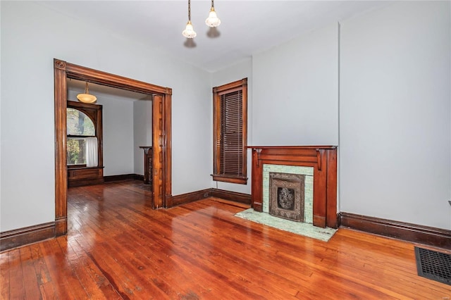 unfurnished living room featuring hardwood / wood-style flooring