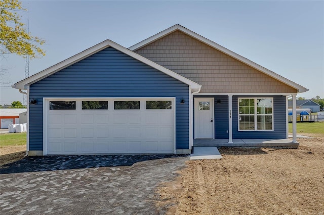 view of front of house featuring covered porch and a garage