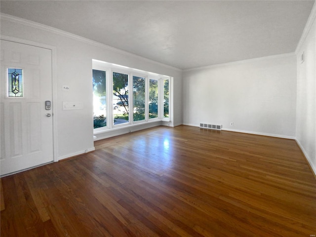 unfurnished living room with ornamental molding and dark hardwood / wood-style floors