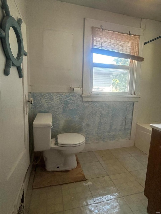 bathroom featuring tile patterned floors, vanity, and toilet