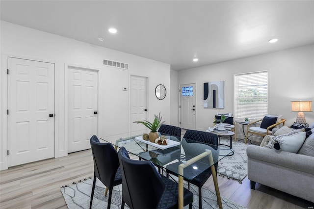 dining room with light hardwood / wood-style flooring