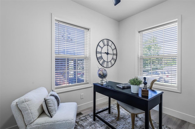 home office with hardwood / wood-style floors