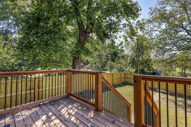 wooden terrace with a yard