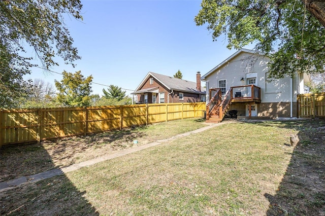 view of yard with a wooden deck