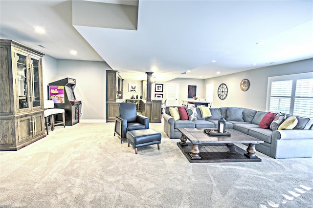 living room featuring light carpet, baseboards, and recessed lighting