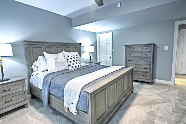 bedroom with baseboards, a ceiling fan, and light colored carpet