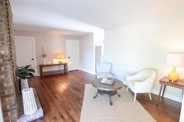 living area with dark hardwood / wood-style floors