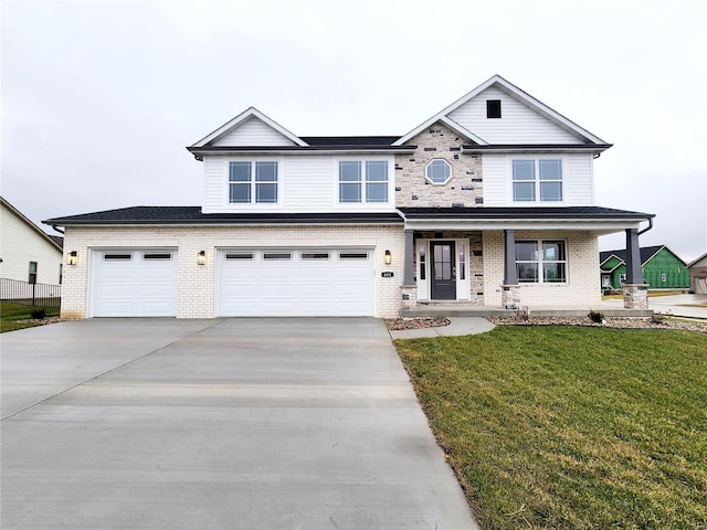 view of front of home featuring a porch, a garage, and a front lawn