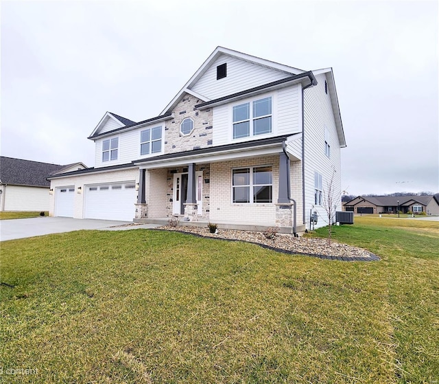 view of front of property featuring covered porch, a garage, central air condition unit, and a front yard