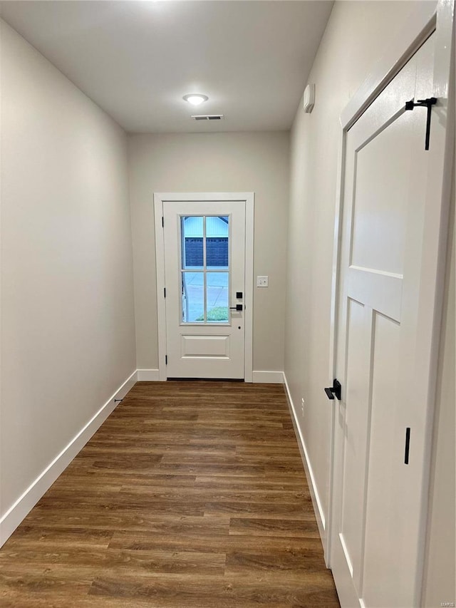 doorway to outside with dark hardwood / wood-style floors