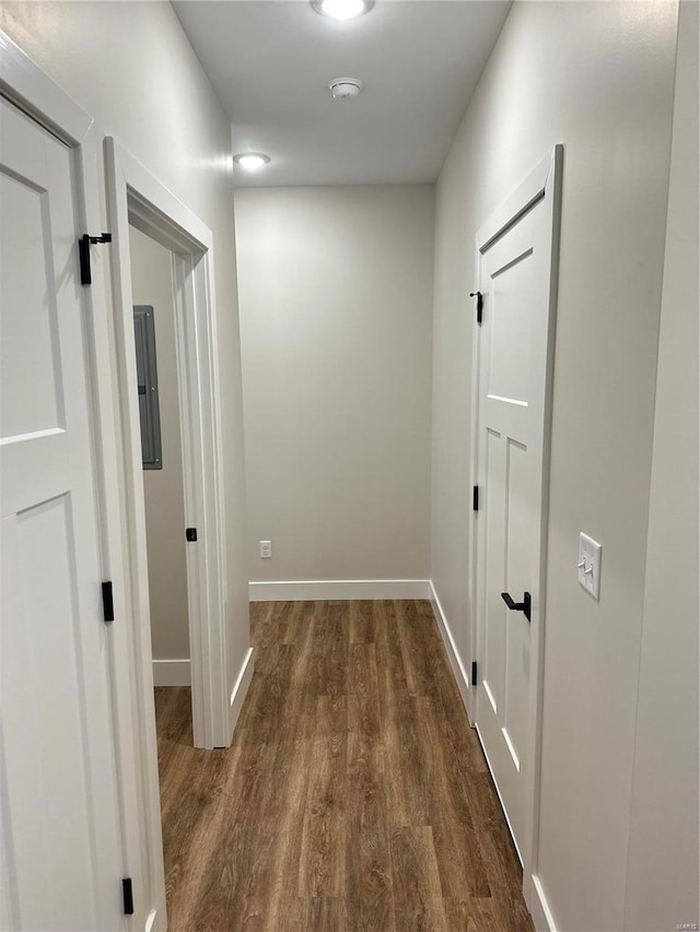 hallway with dark hardwood / wood-style floors