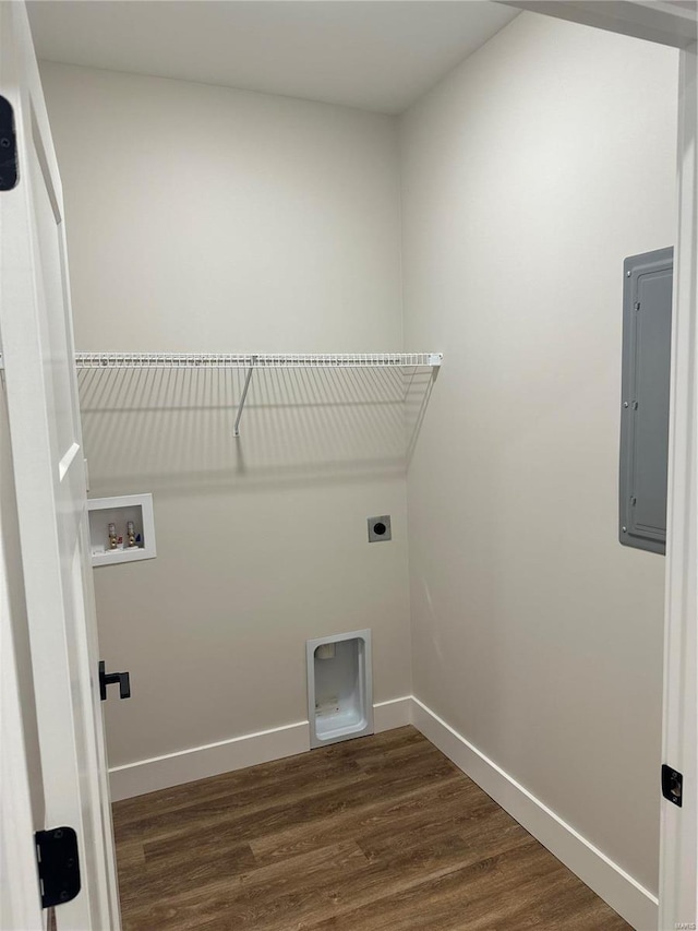 laundry room with electric dryer hookup, electric panel, dark wood-type flooring, and washer hookup